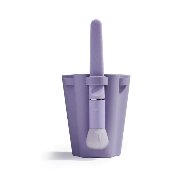 Cepillo de Silicona para Cuidado Facial en color púrpura, diseño compacto y eficiente para limpieza facial.